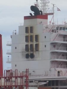  Finally you see it. That's 'The Porthole', the bottome little window of the two to the left of those big air intake screens on the back of the tower. Six stories up!